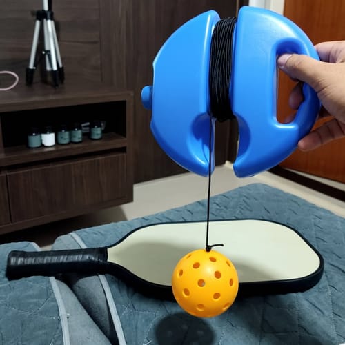 PickleCo trainer and paddle indoors